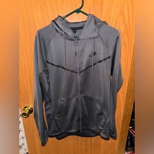 Gray Nike zip up jacket. Size medium.